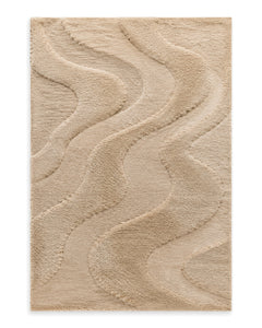 Warm beige shaggy area rug with sculpted organic wave bands on a white background.