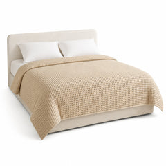 Primeval warm beige waffle grid duvet cover displayed on a styled bed against a clean white studio background