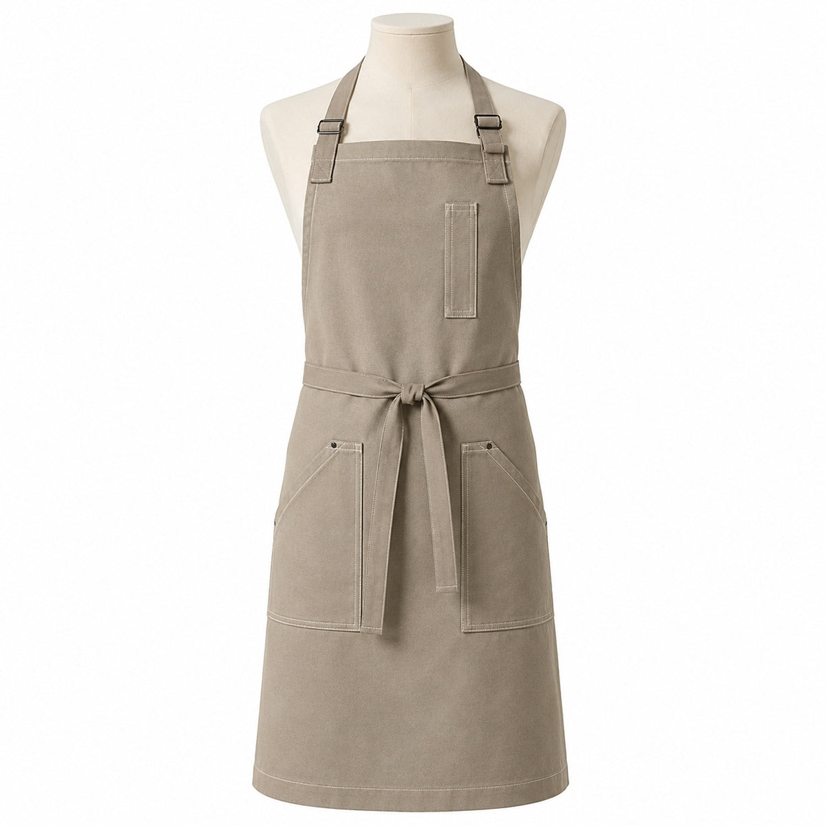 Primeval warm greige chef apron with contrast stitching and utility pockets displayed on a dress form