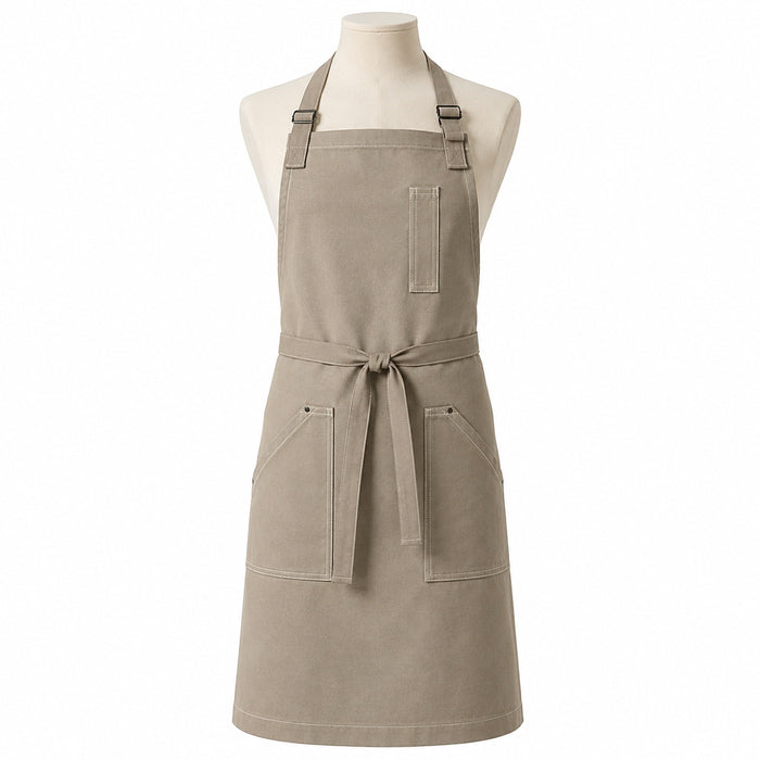 Primeval warm greige chef apron with contrast stitching and utility pockets displayed on a dress form