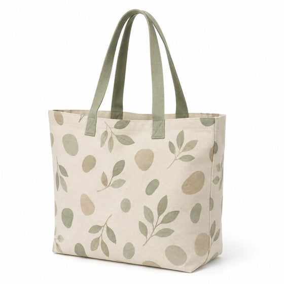Warm ivory tote bag with soft sage organic botanical print and sage handles on a white background.