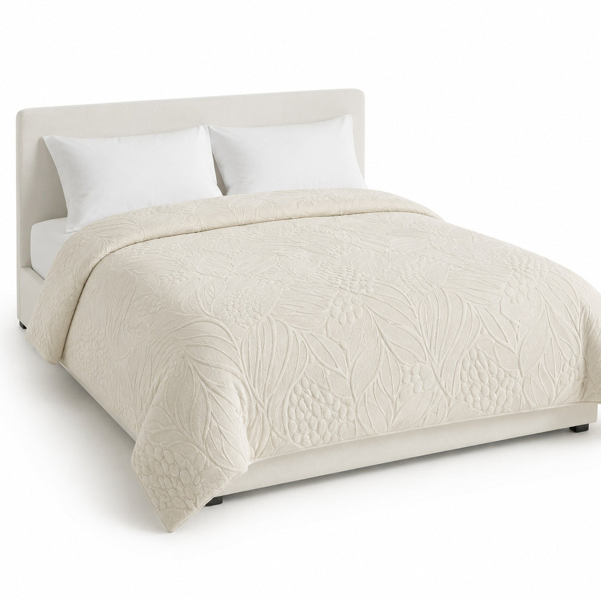 Primeval warm ivory sculpted tonal organic duvet cover displayed on a styled bed against a clean white studio background