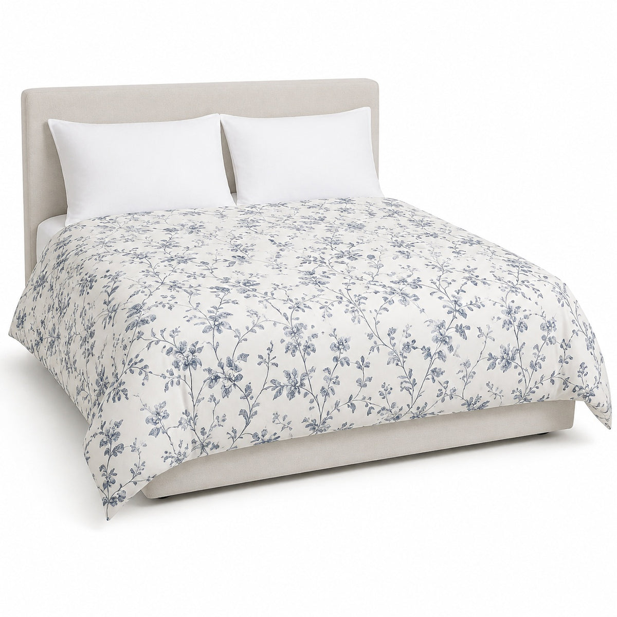 Primeval warm white blue grey delicate floral duvet cover displayed on a styled bed against a clean white studio background