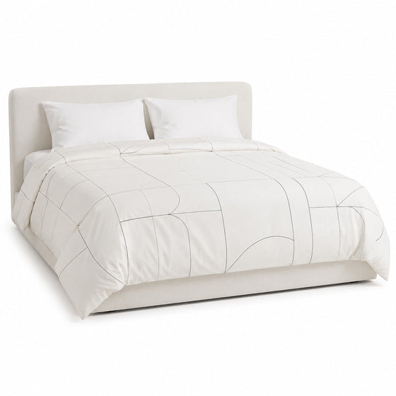 Primeval warm white and charcoal line geometry duvet cover displayed on a styled bed against a clean white studio background