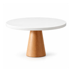 Round white cake display plate on a tapered light natural-wood pedestal base, empty on a white background