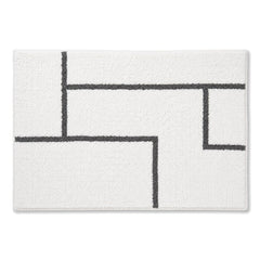 White and charcoal abstract line bath mat for minimalist bathroom decor - Primeval