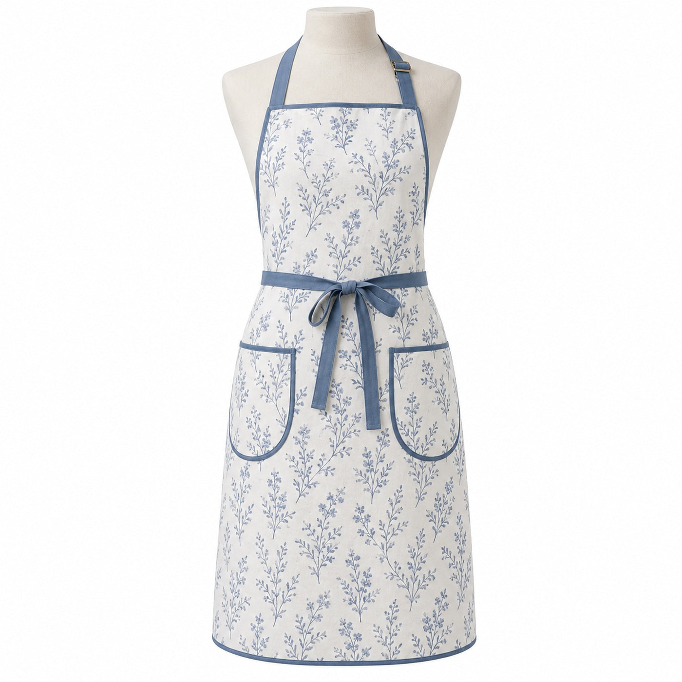 Primeval white chef apron with dusty blue botanical print displayed on a dress form