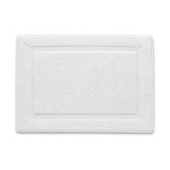 White framed spa bath mat with textured border on white background