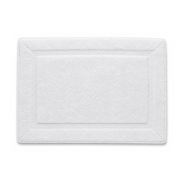 White framed spa bath mat with textured border on white background