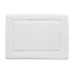 White framed spa bath mat with textured border on white background