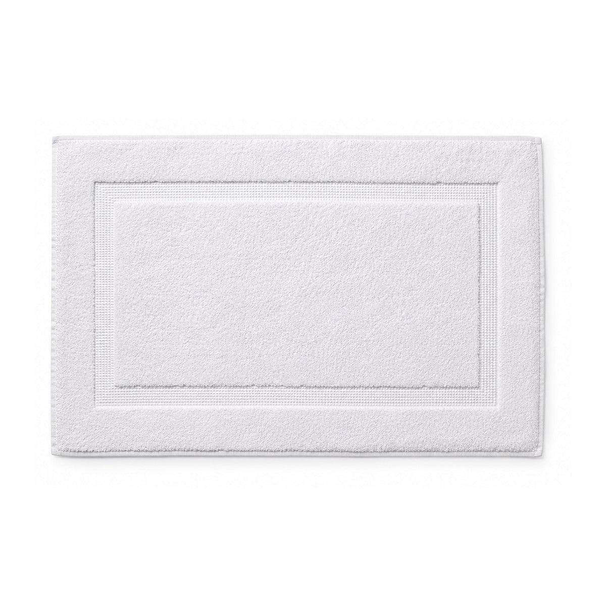 White hotel style bath mat with framed border on white background