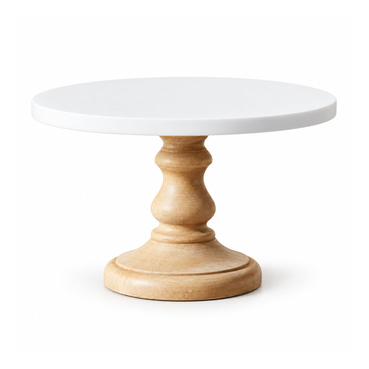 Round white cake display plate on an ornate turned light-wood pedestal with curved contours and wide circular foot
