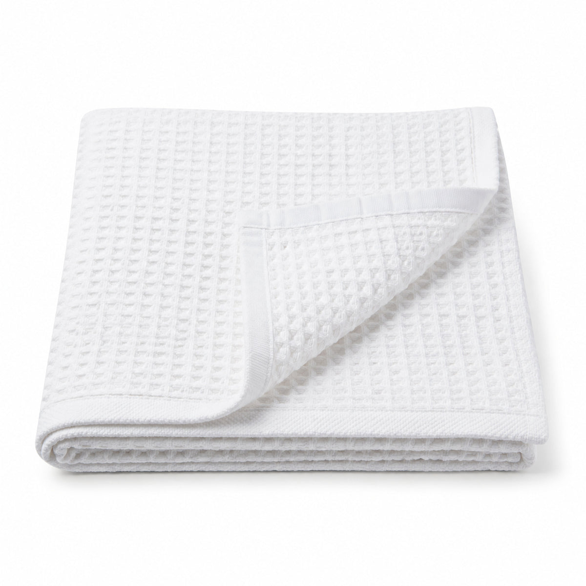 White waffle weave cotton bath towel 70x140 cm on white background