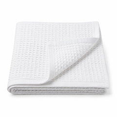 White waffle weave cotton bath towel 70x140 cm on white background