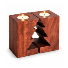 Rectangular reddish-brown wooden candle holder with central Christmas tree cutout and two lit white tealights on top