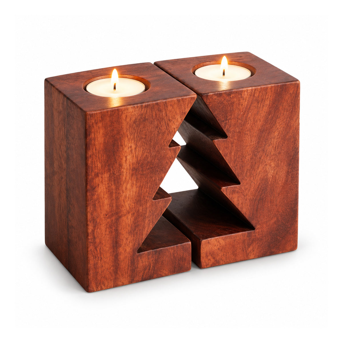 Rectangular reddish-brown wooden candle holder with central Christmas tree cutout and two lit white tealights on top