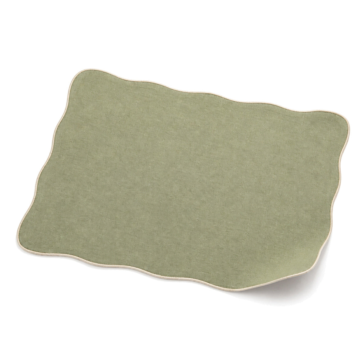 Sage green scalloped-edge placemat shown in a premium angled presentation, lightweight table linen by Primeval