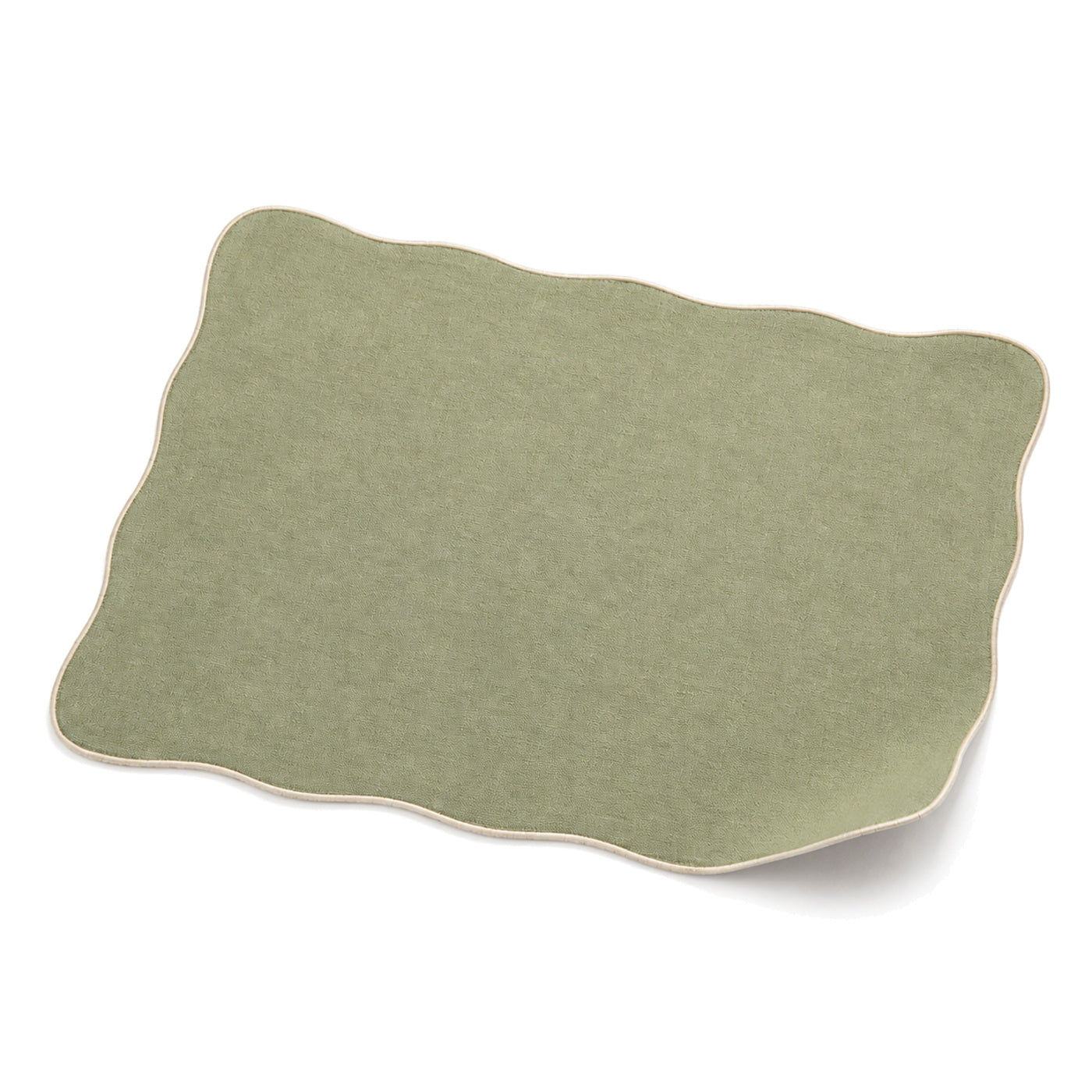 Sage green scalloped-edge placemat shown in a premium angled presentation, lightweight table linen by Primeval