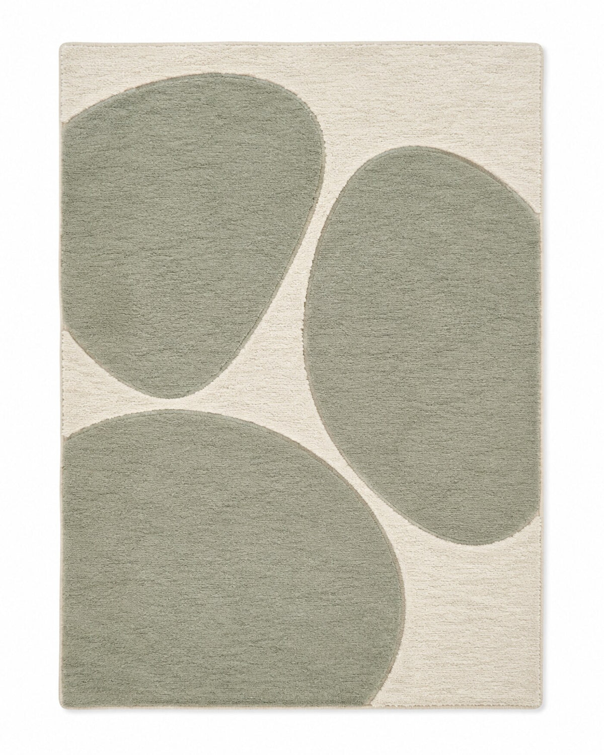 Ivory area rug with large sage green organic pebble shapes and soft modern styling