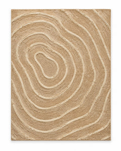 Tan area rug with ivory topographic contour rings and sculptural organic pattern